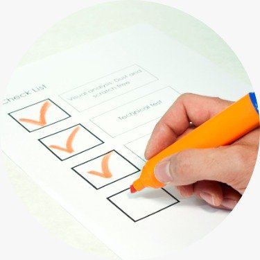 Hand checking items off a checklist with marker.