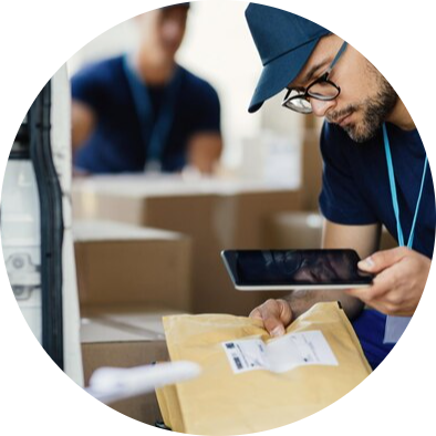 Delivery worker scanning package with tablet